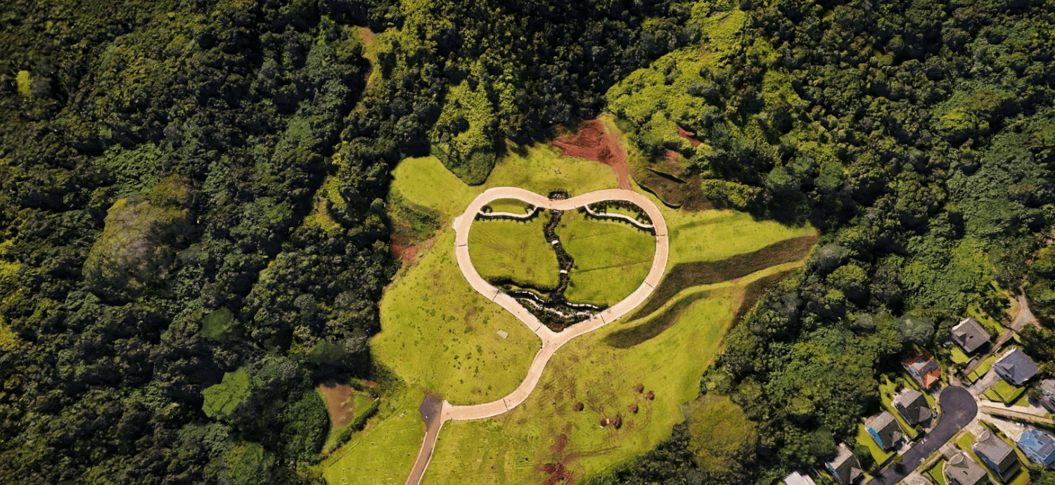 Top-down geographic view of a landscaped landmark within dense green terrain